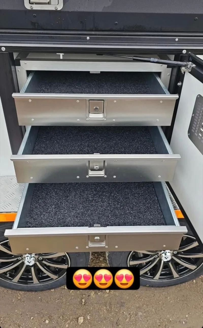 METBOX carpet-lined aluminum locking storage drawers on a custom trailer or vehicle