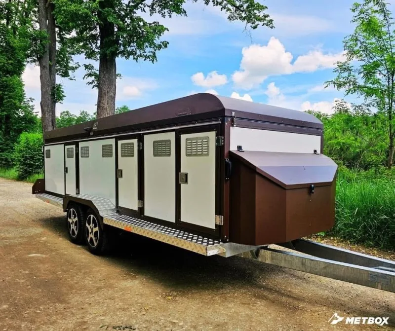METBOX brown and cream multi-door dog transport trailer with diamond plate steps