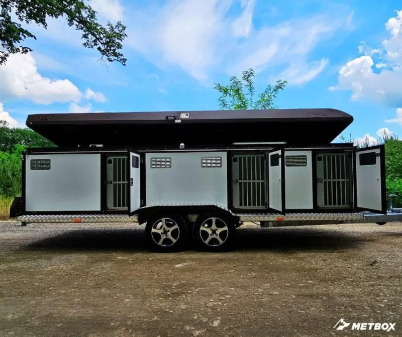 METBOX multi-compartment dog trailer with several crate doors open, white and black finish