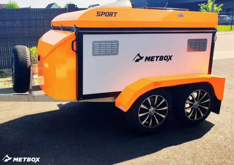 METBOX Sport orange and white dual-axle dog transport trailer side view